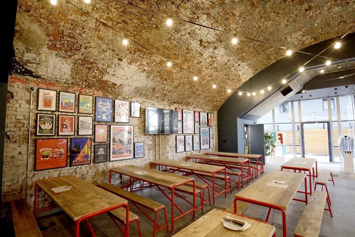 Camder Town Brewery, which is under a railway arch with exposed brick walls and fairylights hanging from the ceiling. 