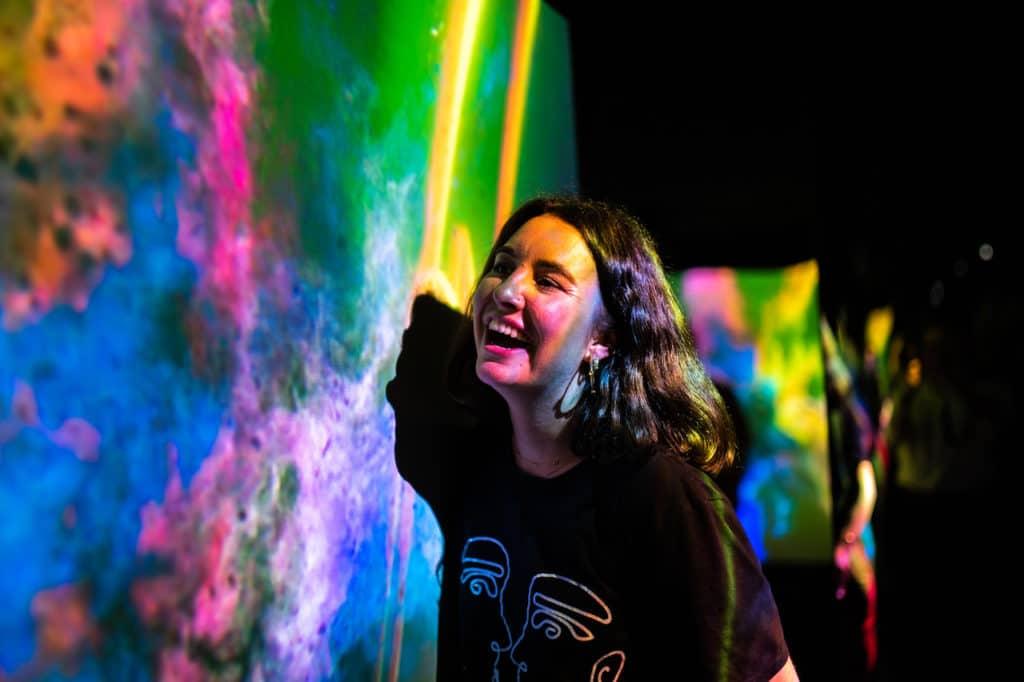 A woman laughing at Dopamine Land, one of the best things to do in Kensington